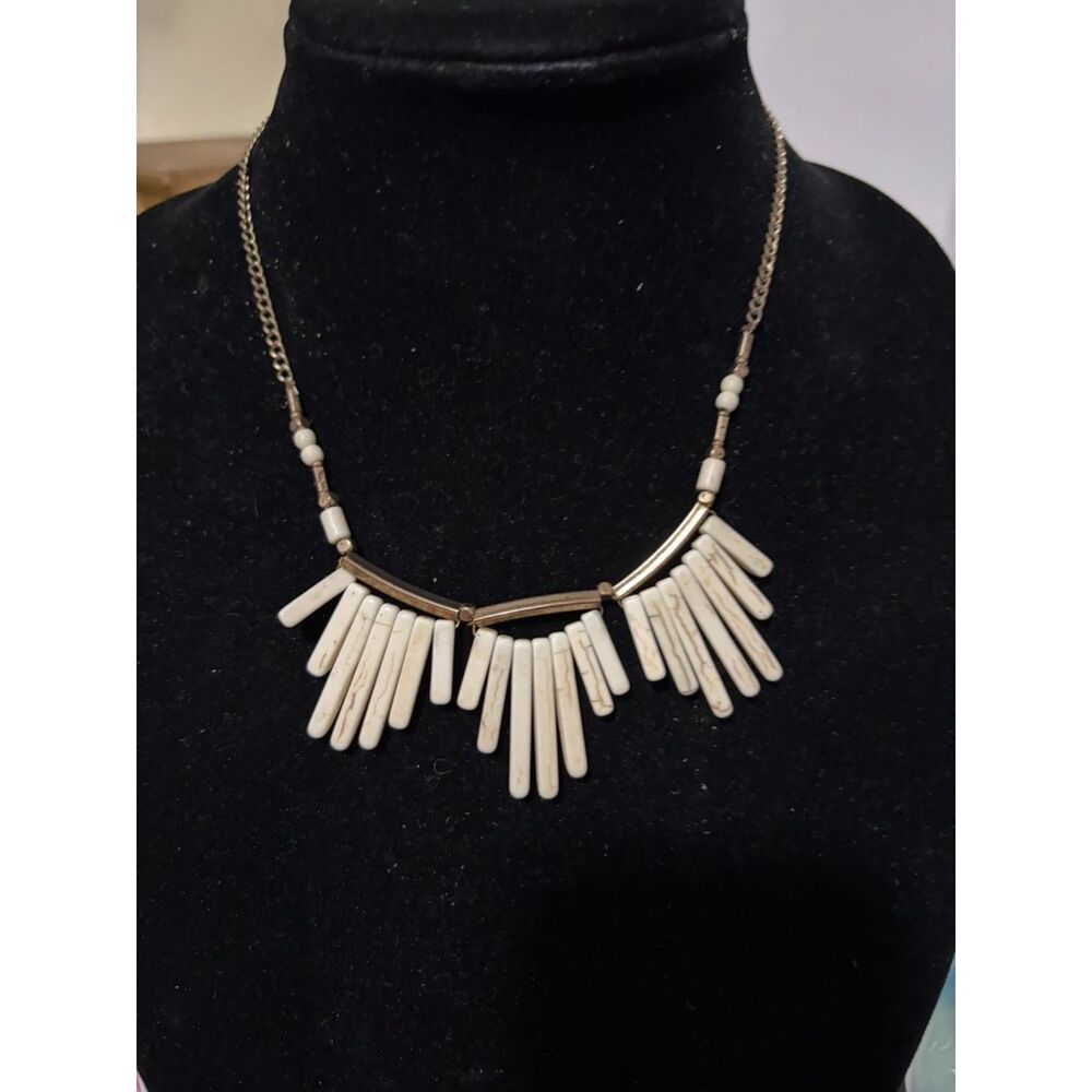 gold tone fringe bib necklace with white howlite spike beads